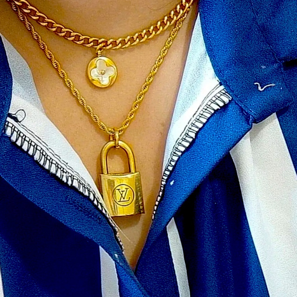 Louis Vuitton, authentic lock with double chain and pendant